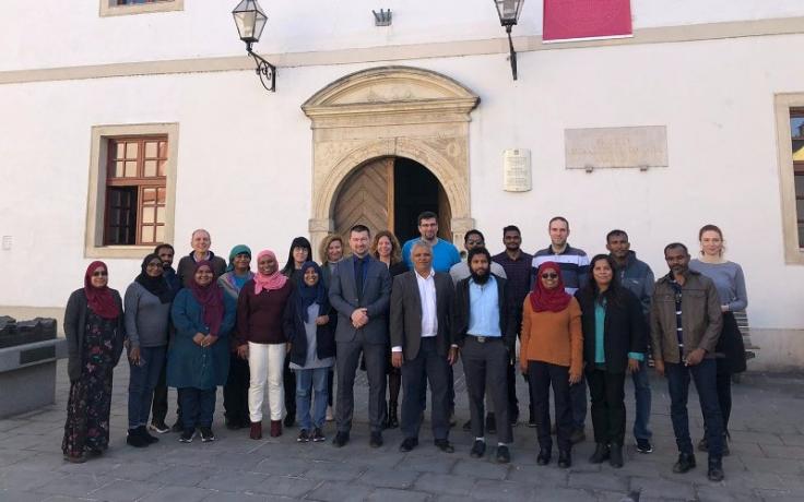 AMED partners in front of FOI